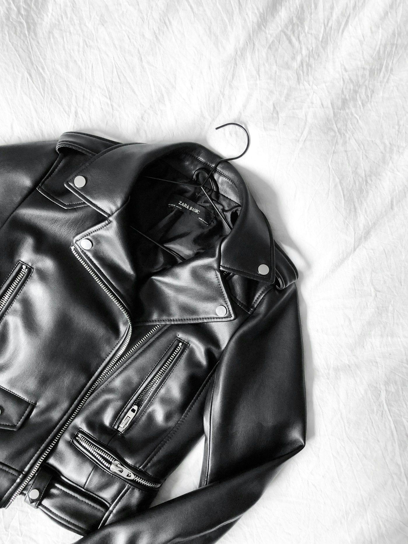 Black zip-up leather jacket produced for a private label client