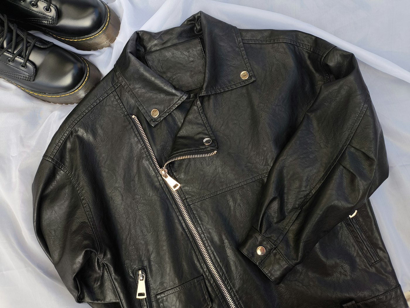 Black leather jacket styled for a brand lookbook