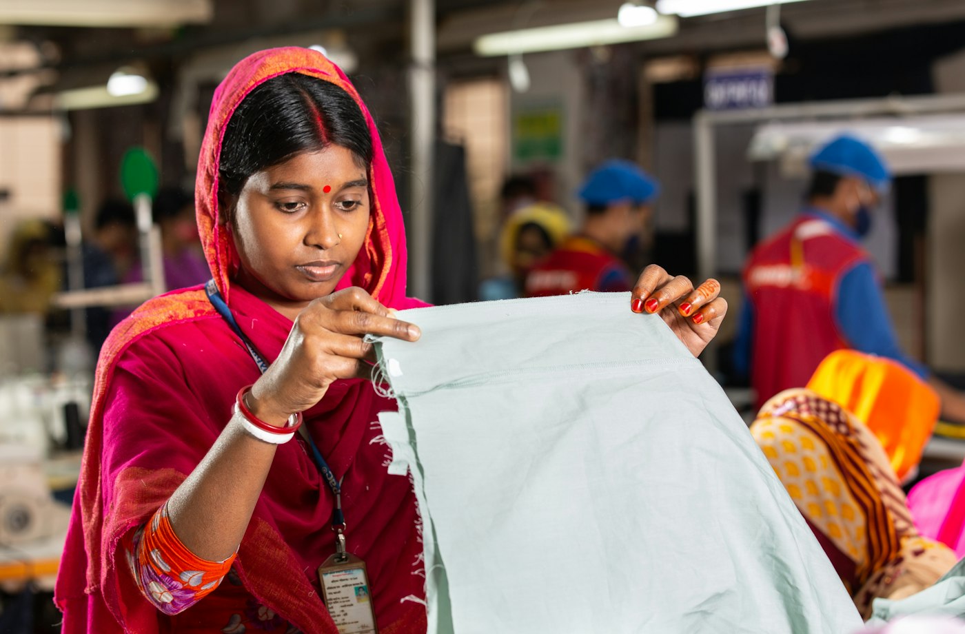 Quality inspector checking fabric before production